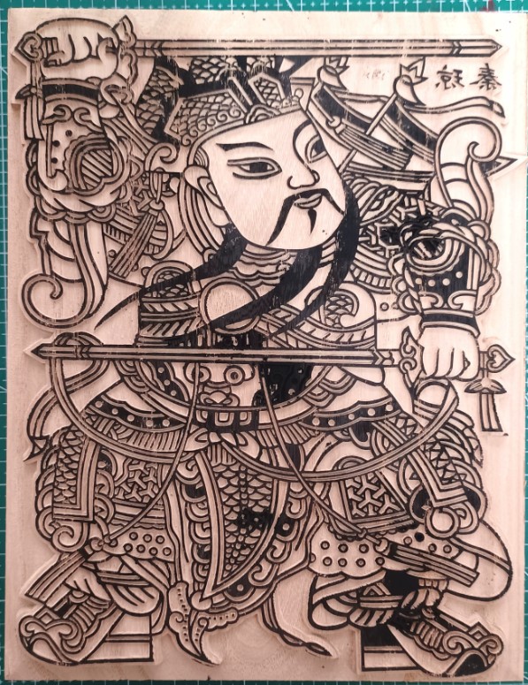 A carved Guardian wood block ready for rubbing